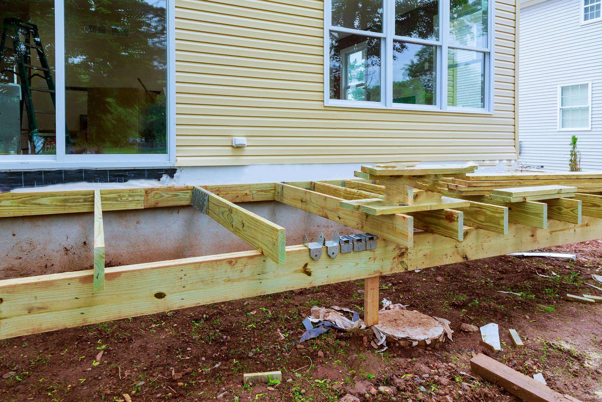 Repair and replacement of wooden deck or patio with modern material installation new home